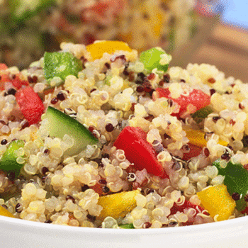 Bowl of cooked quinoa mixed with vegetables